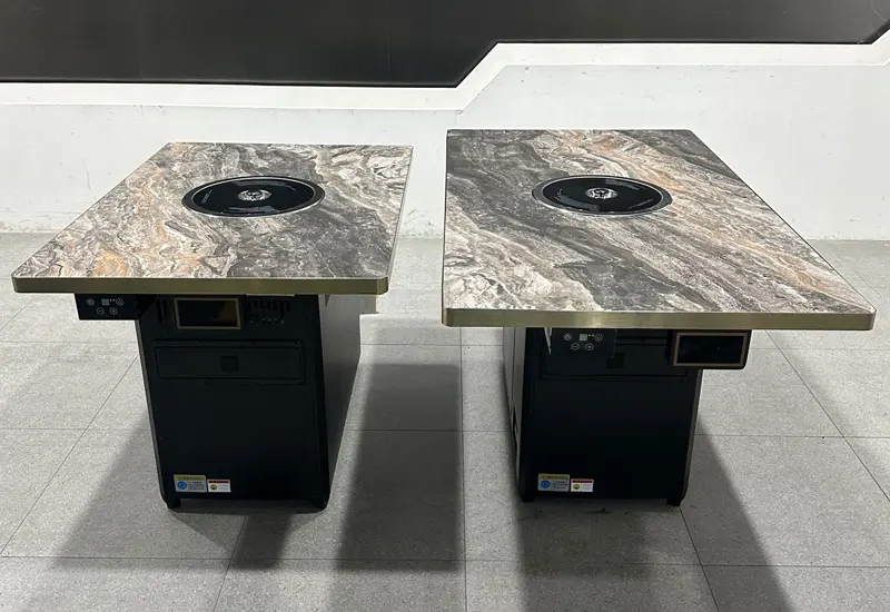 自助烤肉餐廳不鏽鋼包邊（biān）岩板台（tái）麵智能無煙（yān）淨化烤肉桌