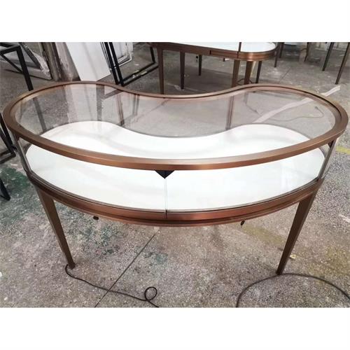 高端不鏽鋼珠寶展（zhǎn）櫃（guì）_拉絲鈦金弧形不鏽鋼玻（bō）璃展示櫃